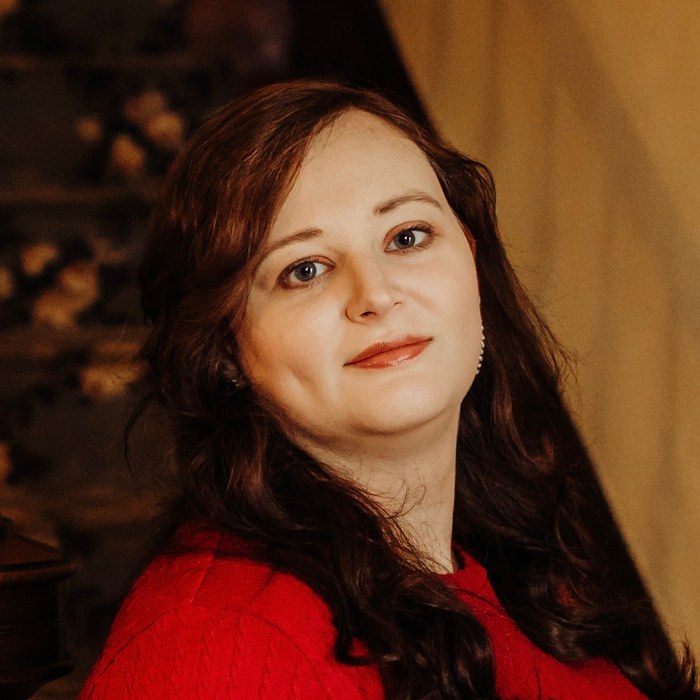 Portrait of children's author Amanda Young in a red sweater